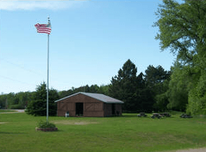 Flag and building at Stigman's Mound Park